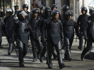 Riot police take their positions during clashes with supporters of Muslim Brotherhood