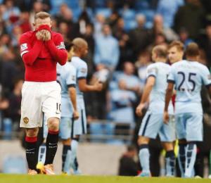 Manchester United"s Wayne Rooney (L) reacts at the final whistle during their English Premier League soccer match against Manchester City at the Etihad Stadium in Manchester, northern England