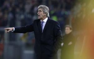 Manchester City"s coach Manuel Pellegrini reacts during the Champions League Group E soccer match against AS Roma at the Olympic stadium in Rome