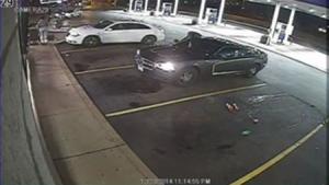 Surveillance video showing an officer-involved shooting during a routine business check at a gas station in Berkeley, Missouri