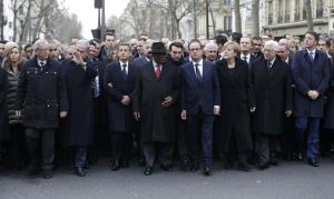 French President Francois Hollande is surrounded by head of states including (first row,LtoR) European Commission President European Commission President Jean-Claude Juncker, Israel's Prime Minister Benjamin Netanyahu, Mali's President Ibrahim Boubacar Keita, Germany's Chancellor Angela Merkel, Palestinian President Mahmoud Abbas and Italy's Prime Minister Matteo Renzi as they attend the solidarity march (Marche Republicaine) in the streets of Paris January 11, 2015. French citizens will be joined by dozens of foreign leaders, among them Arab and Muslim representatives, in a march on Sunday in an unprecedented tribute to this week's victims following the shootings by gunmen at the offices of the satirical weekly newspaper Charlie Hebdo, the killing of a police woman in Montrouge, and the hostage taking at a kosher supermarket at the Porte de Vincennes