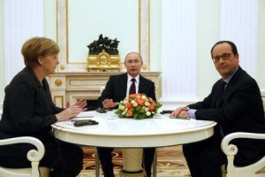 Russian President Vladimir Putin (centre) holds talks with French President Francois Hollande and German Chancellor Angela Merkel at the Kremlin in Moscow