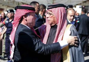 A picture released by the Jordanian Royal Palace shows King Abdullah II (L) greeting Safi, the father of Jordanian pilot Maaz al-Kassasbeh, on February 5, 2015 during a visit to offer his condolences to the family in Karak