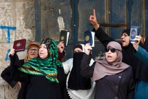 Palestinian women from the Murabitat group protest after being prevented from entering the Al-Aqsa mosques compound in Jerusalem's Old City